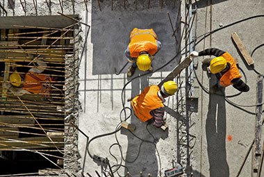 Four workers on site after taking an online OSA construction training course