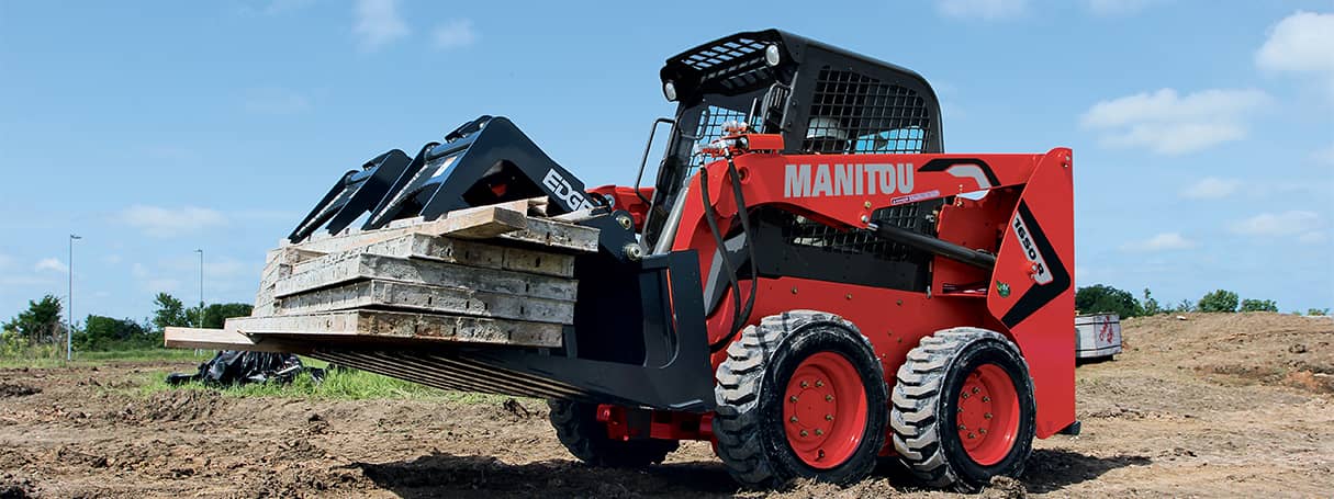 Skid steer rental working with a grapple attachment